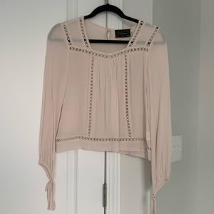 Ivory long sleeve top with cut-out details